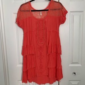Free people dress size small. Coral orange color. In EUC.